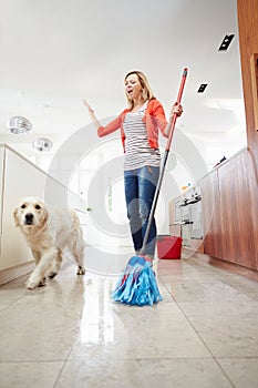 Dog Making Mess Of Newly Mopped Floor photo