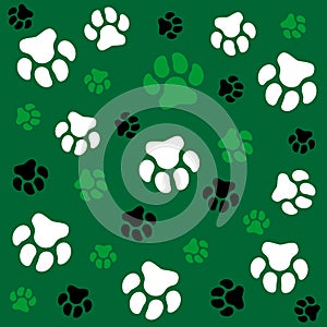 Dog paw. Green background and dog tracks. Pattern with traces.