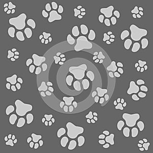 Dog paw. Grey background and dog tracks. Pattern with traces.