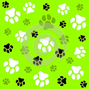 Dog paw. Light green background and dog tracks. Pattern with traces.