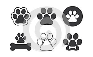 Dog paw prints set. Black silhouettes of paw icons. Vector isolated illustration