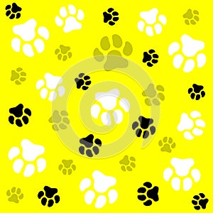 Dog paw. Yellow background and dog tracks. Pattern with traces.