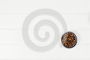 Dog pet food and accessories on white background top view.