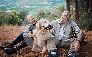 Dog petting, hiking and a couple in nature for travel, relaxation and break on a mountain. Happy, relax and an elderly