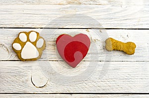 Dog`s paw, red heart and bone. A dog loves bones.