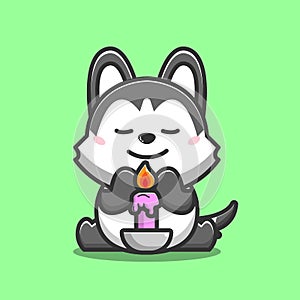 Dog siberian Husky praying with purple candle