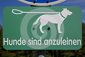 Dog sign with the German text Hunde sind anzuleinen photo