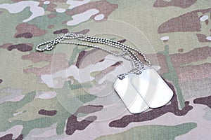 Dog tag on multicam camouflage uniform