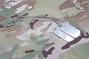 Dog tag on multicam camouflage uniform