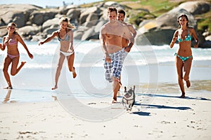 Dog, travel or people running on beach for a fun summer holiday vacation or exercise together. Smile, healthy or group