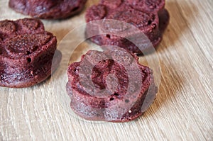 dog treat. pastry food for cat. appetizing dog muffins on wooden background. dog birthday. red velvet. paw shaped dog treat.