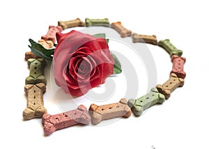 Dog treats in the shape of a heart with a rose