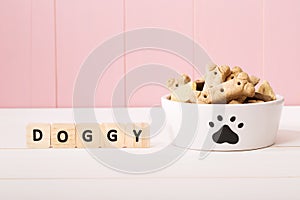 Dog treats on a white bowl