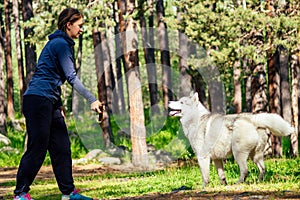 Dog with a woman walking mountains outdoors