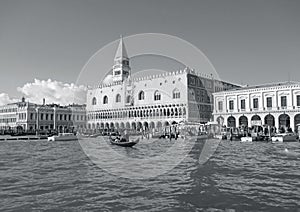 Doge`s Palace and the Companile Bell Tower on the Grand Canal Bank with a Gondola, Venice, Italy