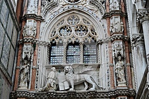 The winged lion and the doge Francesco Foscari on the Doge Palace in Venice, Italy photo