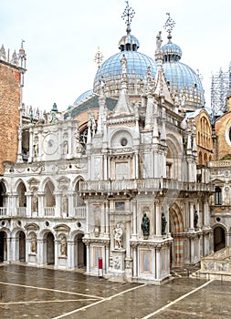 Doge`s Palace or Palazzo Ducale, Venice, Italy. It is famous landmark of Venice. Ornate facade of Doge`s Palace and domes of St