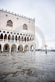 Doges Palace Palazzo Ducale on Saint Mark square at Rainy Morning in Venice