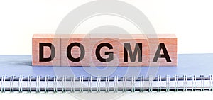 DOGMA word concept written on a light table and light background