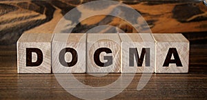 Dogma Word In Wooden Cubes. Social concept photo