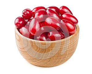 Dogwood berry in a wooden bowl isolated on white background