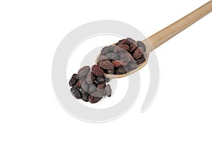 Dogwood or Cornel fruit herb used in herbal medicine on wooden spoon isolated on white background. Herbs. Alternative medicine
