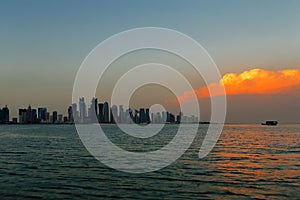 Doha, Qatar: A beautiful sunset cloud over the city skyline