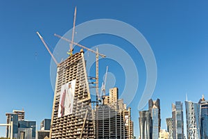 Doha, Qatar - Jan 8th 2018 - Moderns buildings under construction in downtown Doha in a blue sky day in Qatar.