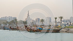 Doha, Qatar- Multiple wooden fishing dhows docked in the doha corniche