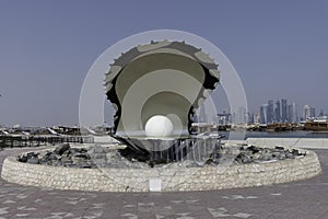 Qatar, Doha, Pearl Oyster Monument with its fountain at the northern end of the Corniche.