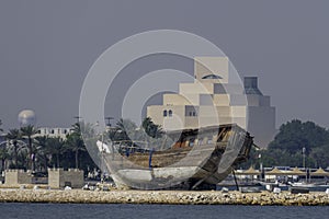 Qatar, Doha, traditional wooden Arab dhow in front of the national museum photo