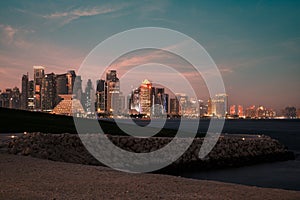 Doha Qatar skyline at night from  Museum of Islamic art garden