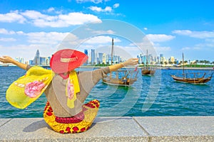 Doha seafront happy woman