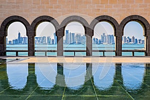 Doha skyline through the arches of the Museum of Islamic art, Do