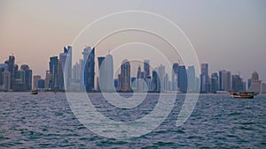 Doha skyline from the Cor niche sunset shot showing the Arabic Gulf with dhows