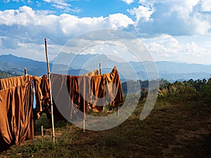 Doi Luang Chiang Dao mountain and hanging clothes under the sun