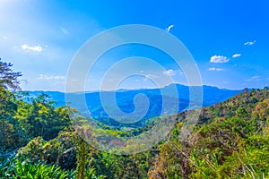 at Doi Pha Mee view point you can see Doi Nangnon in Maesai Chiang Rai shape of mountains look like women sleeping photo