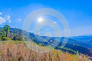 at Doi Pha Mee view point you can see Doi Nangnon in Maesai Chiang Rai shape of mountains look like women sleeping photo