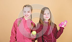 Doing whatever they want. Sport success. gym workout of teen girls. Tennis racket and ball for activity. Little girl