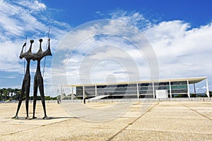 Dois Candangos Monument and Planalto Palace Building in Brasilia, Brazil
