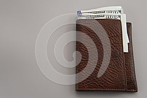 dolars in wallet on gray background