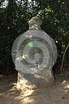 Dolharubang stone grandfather with cacti made of stone in their hands