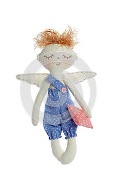 Doll boy in blue color wear isolated on white background. Toy or interior decoration