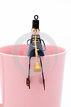 Doll on cup