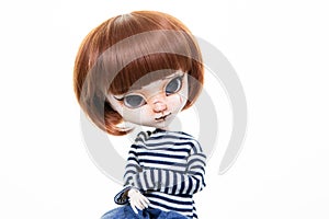 Doll face portrait close up with copy space girl childhood toys in white background