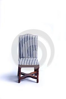 Doll house interior - chair isolated on white background. Vertical image