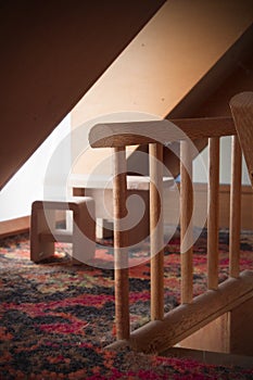 Doll House Staircase Next To Table And Chairs