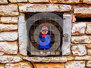 Doll of old Man Locked in Wall Cage in France