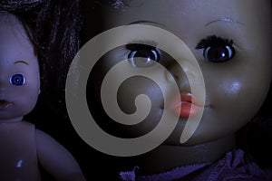 Doll portrait on a black background.