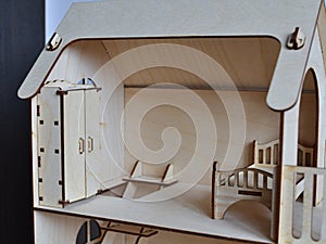 A doll`s bedroom in a wooden doll house.